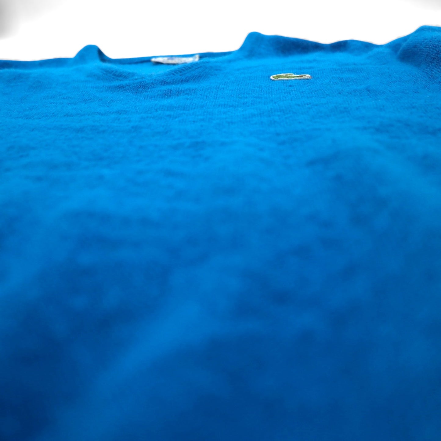 Vintage 70s Lacoste V-neck acrylic knit sweater, size XL, blue, with spool tag.