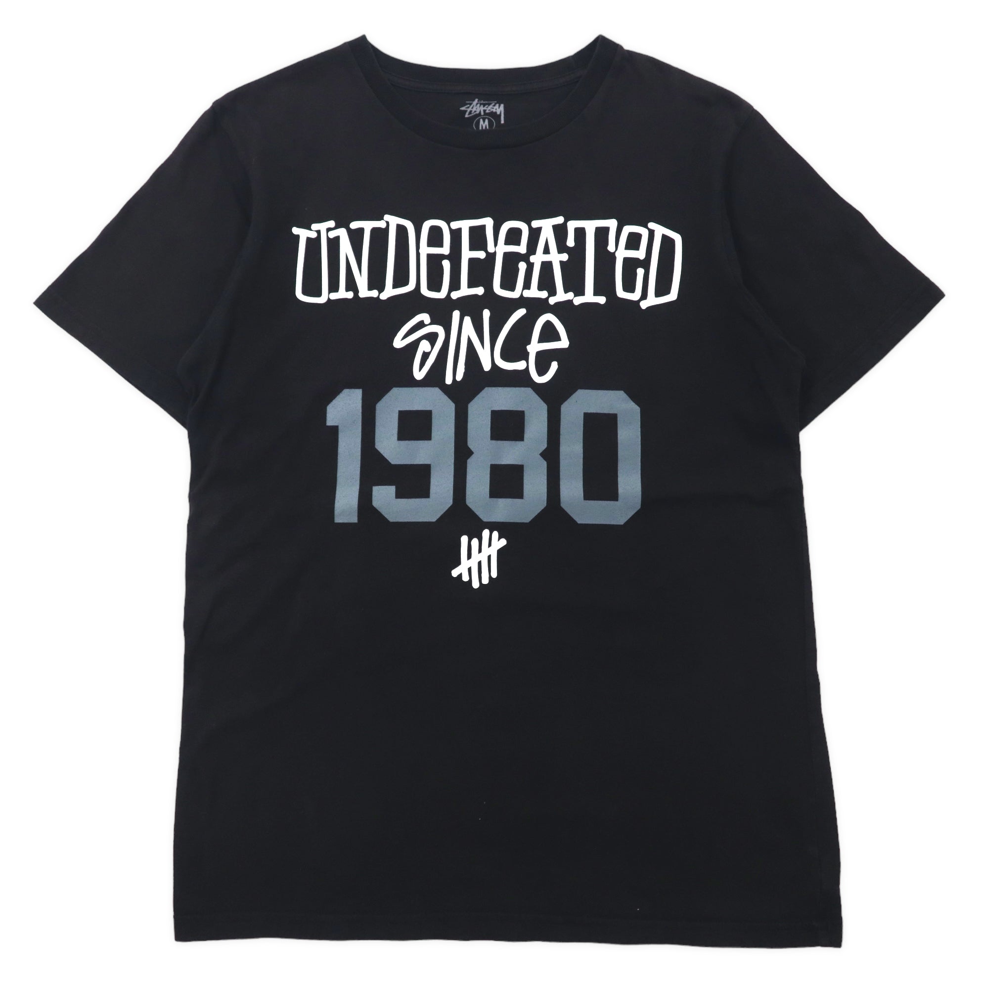 Stussy × UNDEFEATED Print T-Shirt M Black Cotton Named Ring 