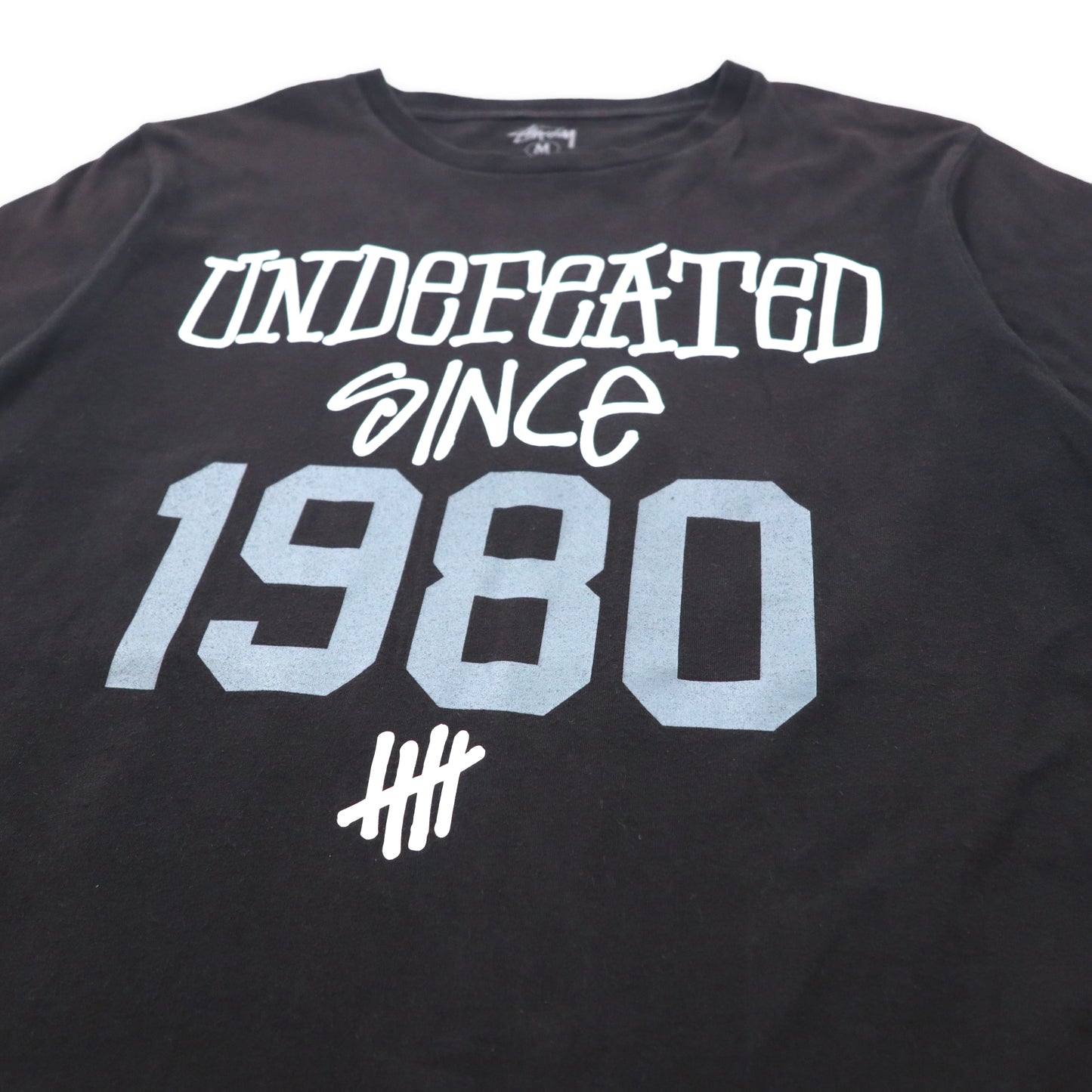 STUSSY × UNDEFEATED Print T-shirt M Black Cotton Numbering Double-sided Print