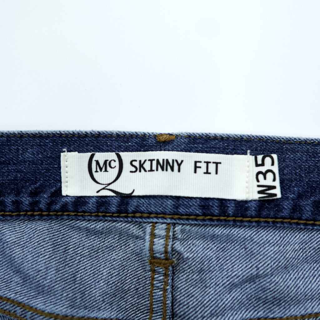 Alexander McQueen Italian-made distressed denim jeans, size L, blue, skinny fit.