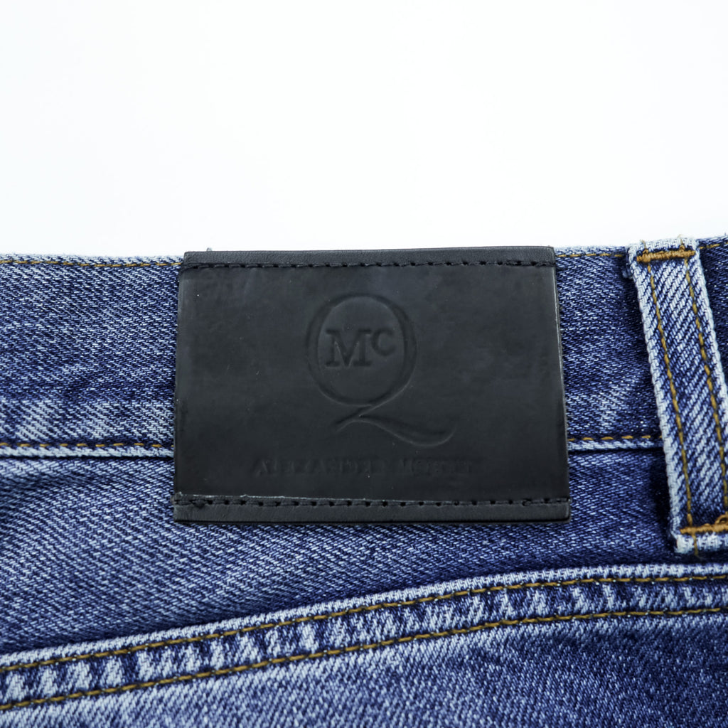 Alexander McQueen Italian-made distressed denim jeans, size L, blue, skinny fit.