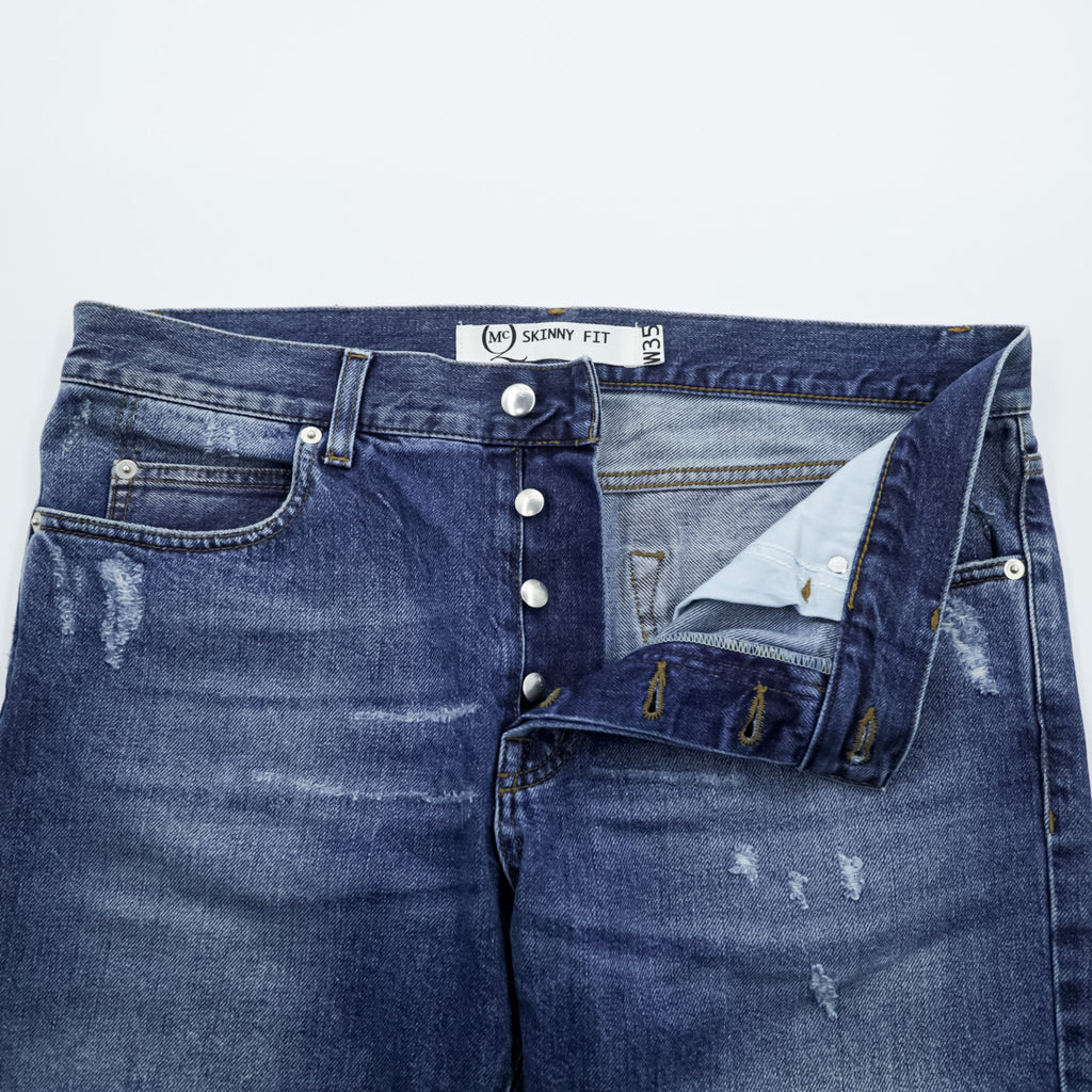 Alexander McQueen Italian-made distressed denim jeans, size L, blue, skinny fit.