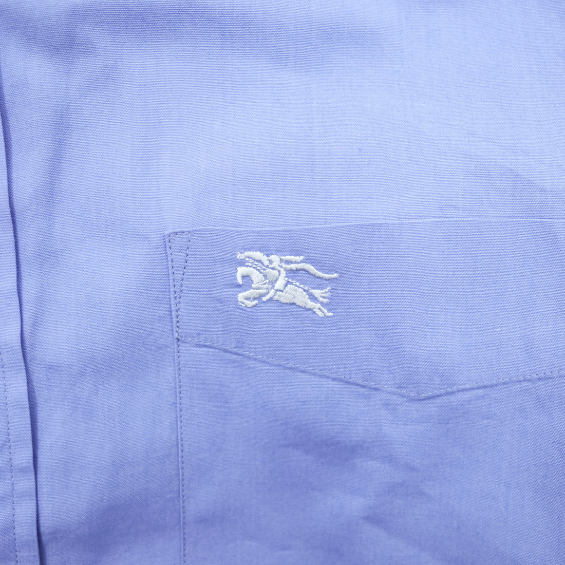 BURBERRY button-down shirt, size M, blue, with a single logo accent.