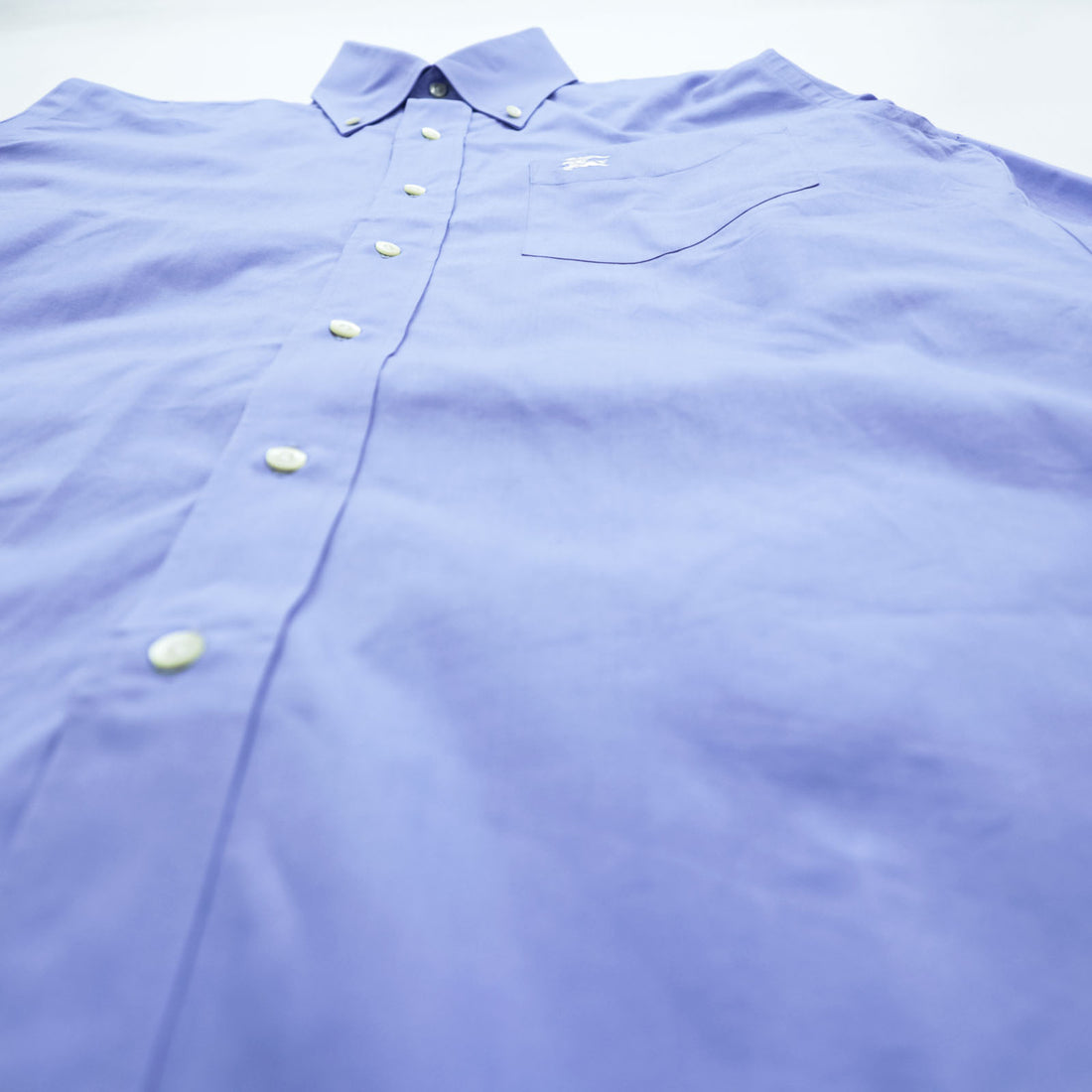 BURBERRY button-down shirt, size M, blue, with a single logo accent.