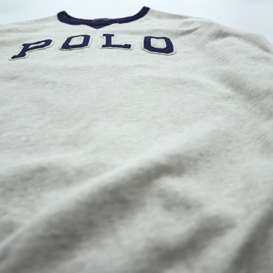 Polo Ralph Lauren V-gusset sweatshirt, size L, beige/navy, with arch logo patch and ribbed trim.