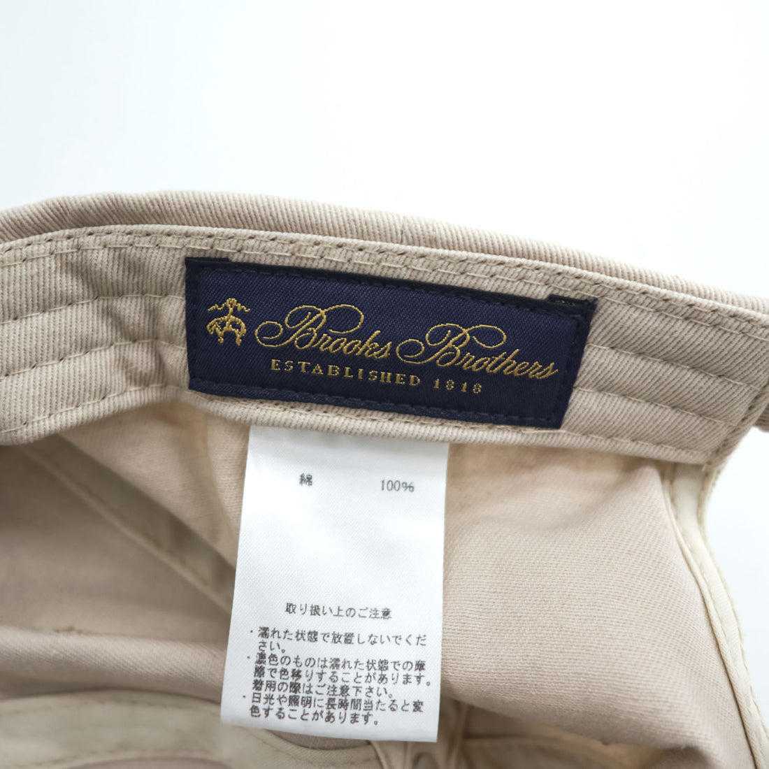 Brooks Brothers cap, beige, with a single logo accent.