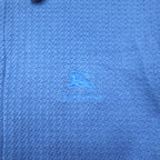 Burberry's USA-made jacquard polo shirt, size M, blue cotton, with one-point logo embroidery.