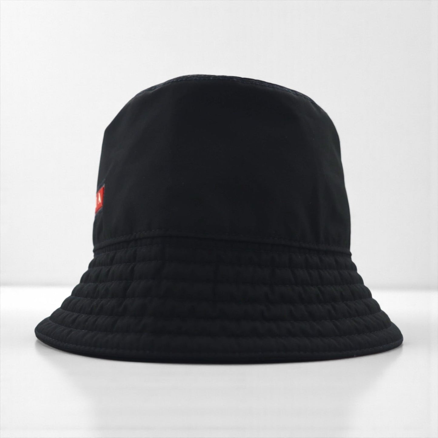 Prada technical fabric bucket hat in black Linea Rossa Sport, made in Italy