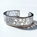 CELINE バングル カフ ブレスレット シルバー メタル カットアウトロゴ 透かし