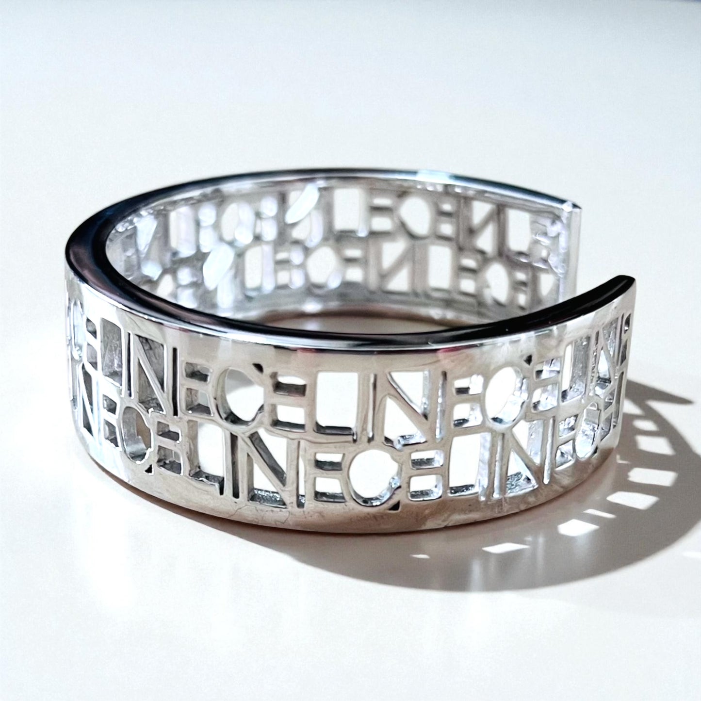 CELINE バングル カフ ブレスレット シルバー メタル カットアウトロゴ 透かし