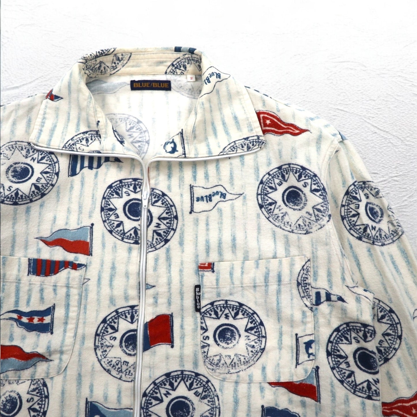 BLUE BLUE スタンドカラー ジップアップジャケット M ホワイト 総柄 フラッグ マリンデザイン 日本製